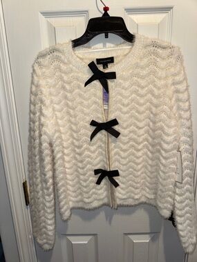 Calligraphie Cream Fuzzy Knit Cardigan with Black Bow Closures